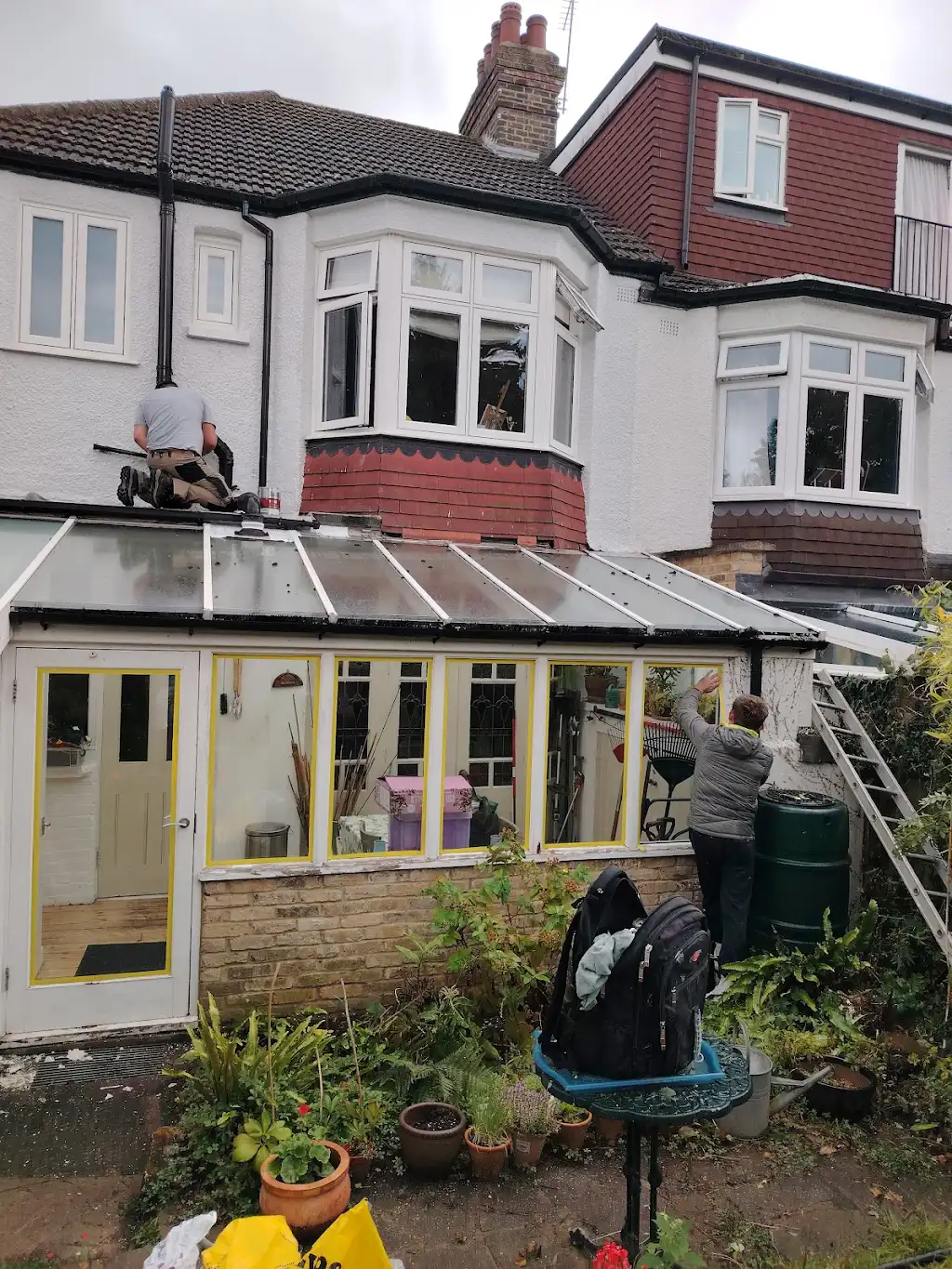 Exterior painting of semi-detached house with conservatory in London