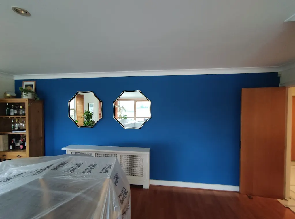 Living room with bold blue Farrow and Ball feature wall