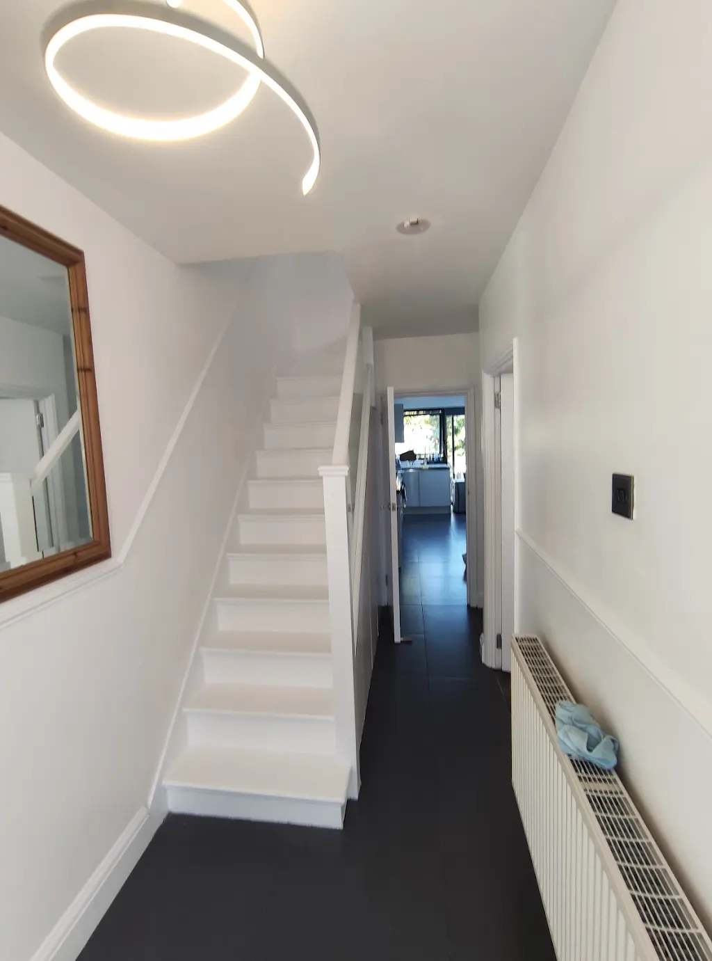 Hallway and staircase with freshly painted white walls